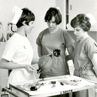 Student nurses learning about equipment